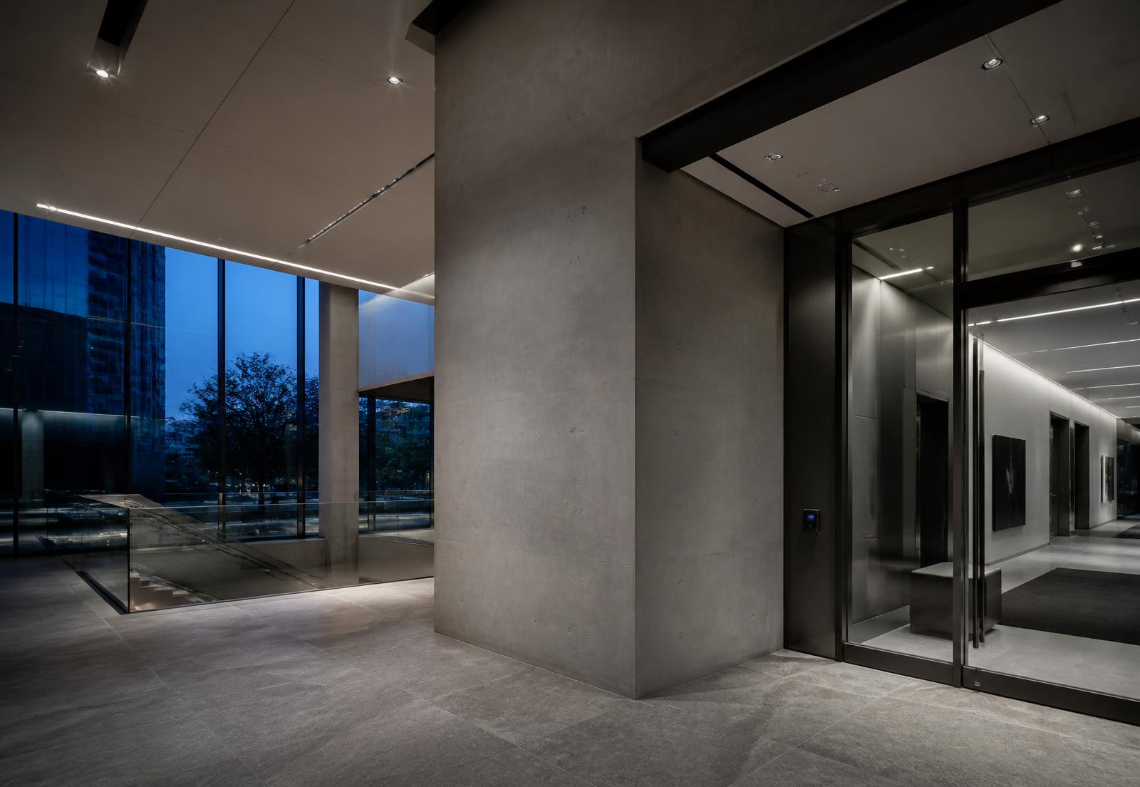 Commercial building entrance with integrated lighting, glazing and a discreet access control reader